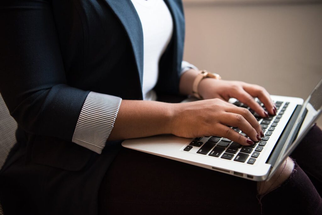 a person using a macbook - Online Typing Jobs