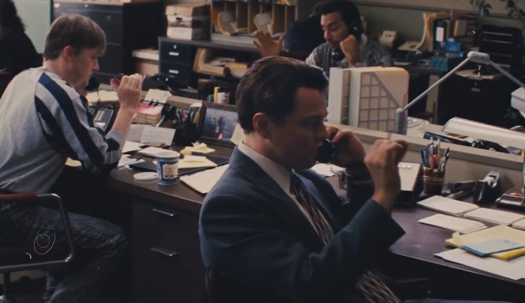 call Scene from famous movie wolf of wall street displaying manipulation on buying fraud stocks